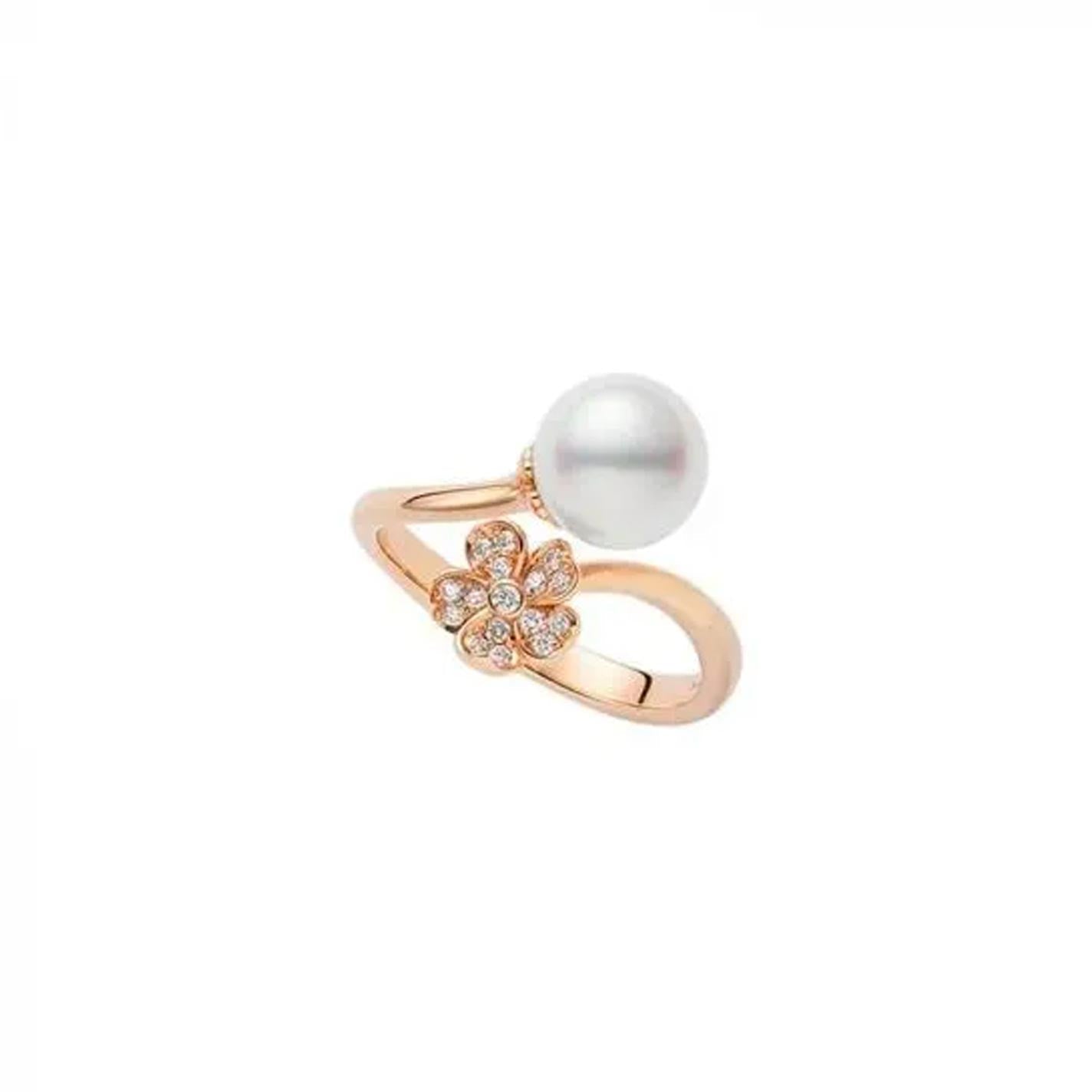 The Mikimoto Cherry Blossom 18K Rose Gold Diamond with Akoya Cultured Pearl Ring features an elegant open design, highlighting an Akoya cultured pearl on one side and a Cherry Blossom motif embellished with sparkling diamonds on the other. The exquisite piece, crafted by Mikimoto, is beautifully presented against a plain white background.