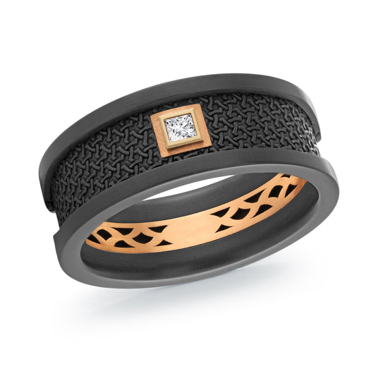 The Malo Carbon Fiber And 14K Rose Gold 8mm Wedding Band by Malo showcases a striking two-toned design with an intricate black carbon fiber surface, accentuated by a small square diamond set within a rose gold frame. The inner band features a carved gold pattern, adding elegance and contrast to the overall look.