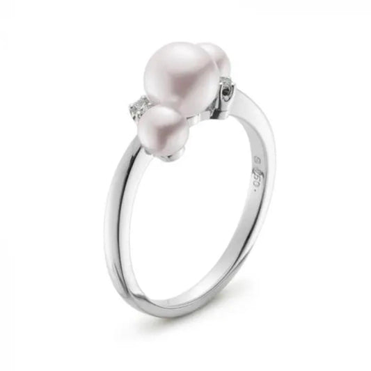 The Mikimoto Bubbles 18K White Gold Ring, featuring three luminous Akoya cultured pearls of varying sizes arranged closely together, showcases a sleek and polished band that enhances the pearls' luster.