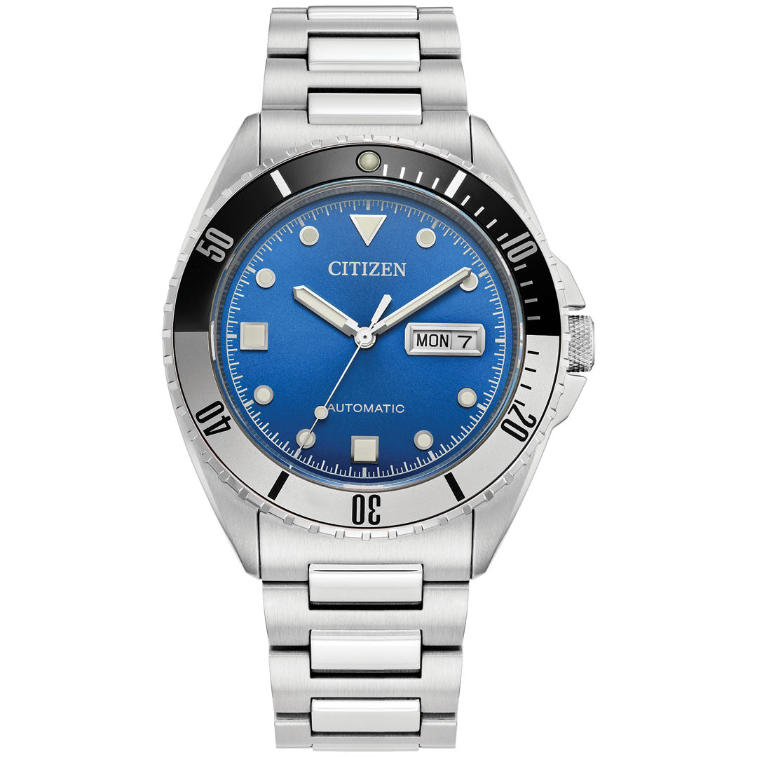 The CITIZEN Sport Automatic 42mm Watch features a silver metal band and an eye-catching blue dial safeguarded by sapphire crystal. The watch face showcases the date and day ("MON 7") along with a black rotating bezel with white markings. Enhanced by high-performance movement, the silver-toned hands and hour markers exude elegance.