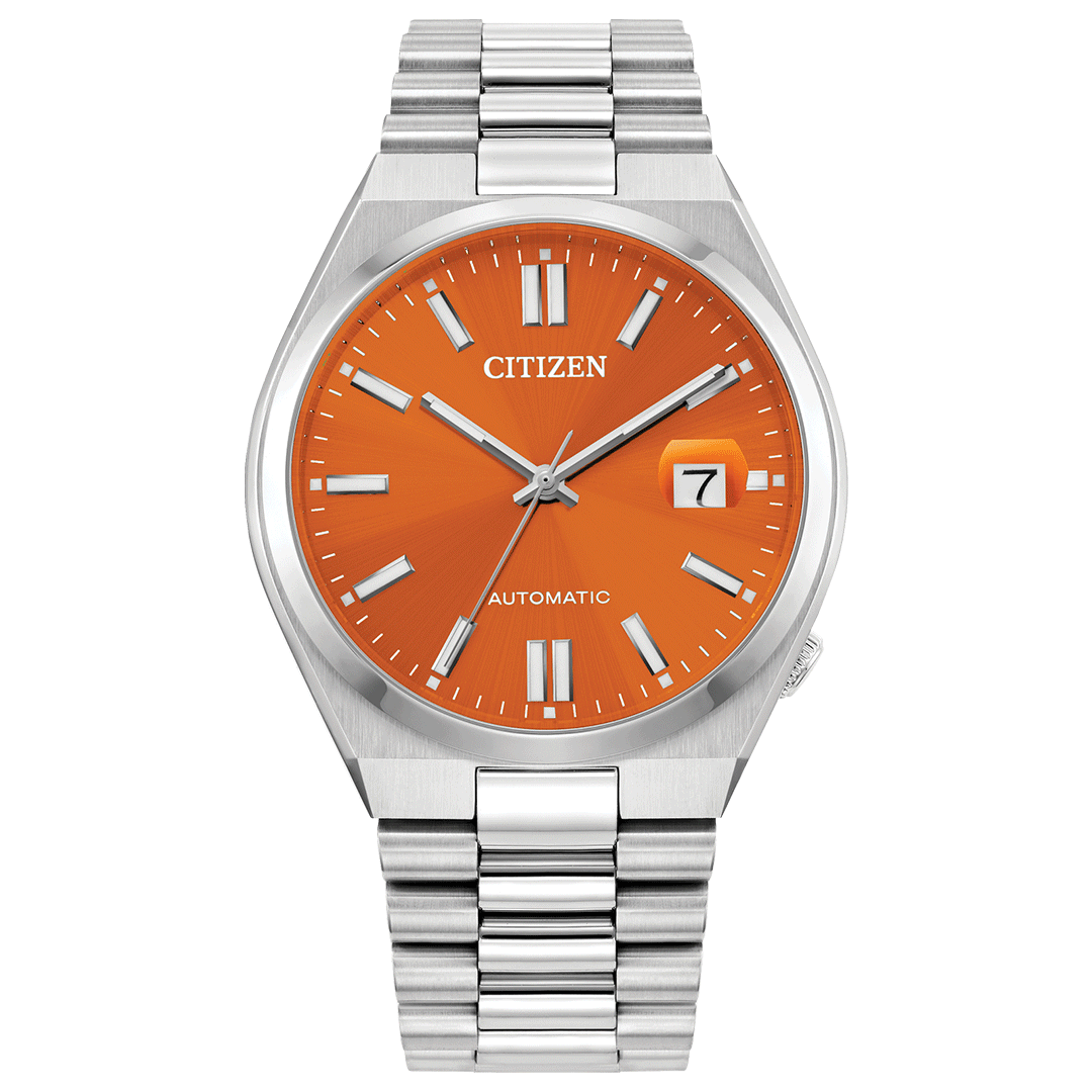 A CITIZEN TSUYOSA Collection Automatic Mechanical 40mm watch featuring an orange dial complemented by a silver stainless steel band. The timepiece includes sapphire crystal, silver hour markers, and silver hands with a date window displaying the number 7. The word "Automatic" is elegantly placed above the 6 o'clock marker, enhancing its sporty design.