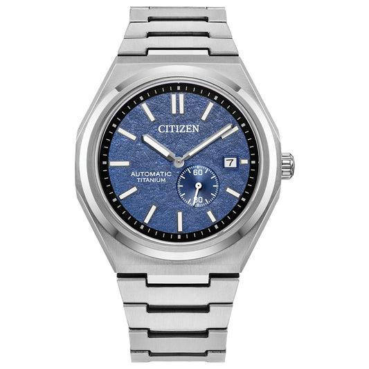 The CITIZEN Zenshin Mechanical Automatic 40.5mm Watch features a Super Titanium™ silver band and case, textured blue dial, silver hour markers and hands, a date window at 3 o'clock, and a subdial above 6 o'clock.
