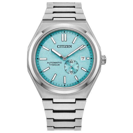 The CITIZEN Zenshin Mechanical Automatic 40.5mm Watch features a metallic band, turquoise dial, silver hour markers, three hands, a small seconds subdial at 6 o’clock, and a date window at 3—a refined yet sporty timepiece.