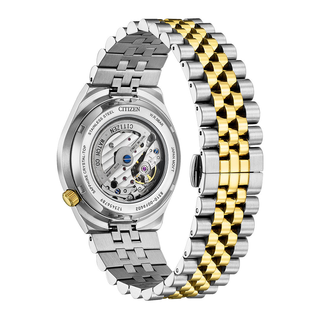 Back view of the CITIZEN TSUYOSA 60 Automatic 40mm Watch by CITIZEN. Its two-tone stainless steel bracelet has alternating silver and gold links, with a matching gold crown and exposed automatic movement.