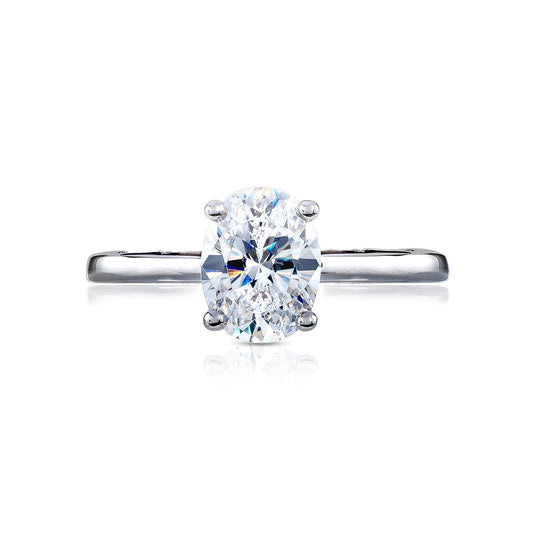 The Tacori Coastal Crescent collection offers a stunning solitaire engagement ring featuring an oval-cut diamond, elegantly set on a refined 14K white gold band with diamond accents.