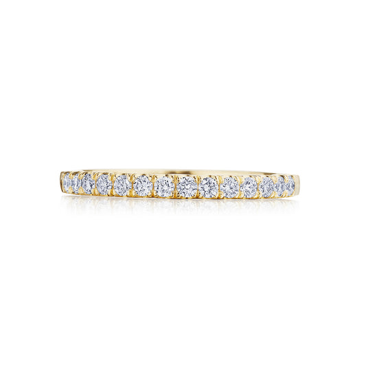 The Tacori Coastal Crescent 14K Yellow Gold Round Brilliant French Pavé Diamond Anniversary Ring features a slender gold band adorned with a row of French pavé diamonds, creating an elegant and refined piece. Skillfully set in yellow gold, the glistening stones beautifully catch the light, highlighting the expertise of Tacori gemologists.
