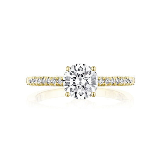 Explore the Tacori Coastal Crescent 14K Yellow Gold Round Brilliant Solitaire Semi Mount with Diamond Band Engagement Ring, expertly designed by Tacori gemologists. This stunning piece showcases a prominent round diamond at its center, complemented by a band adorned with smaller diamonds along the sides, offering timeless elegance and sparkle.
