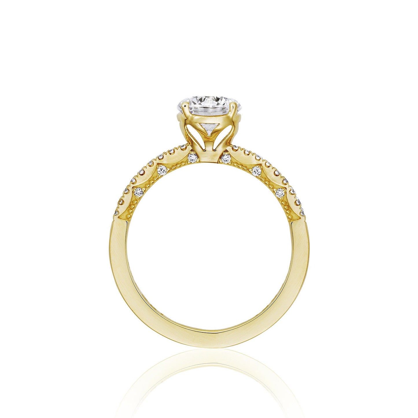 A side view of the Tacori Coastal Crescent 14K Yellow Gold Round Brilliant Solitaire Semi Mount Engagement Ring showcases intricate detailing and a central diamond setting. The band is adorned with round-brilliant diamonds along the top half, creating a delicate design that captures the elegance of Tacori.