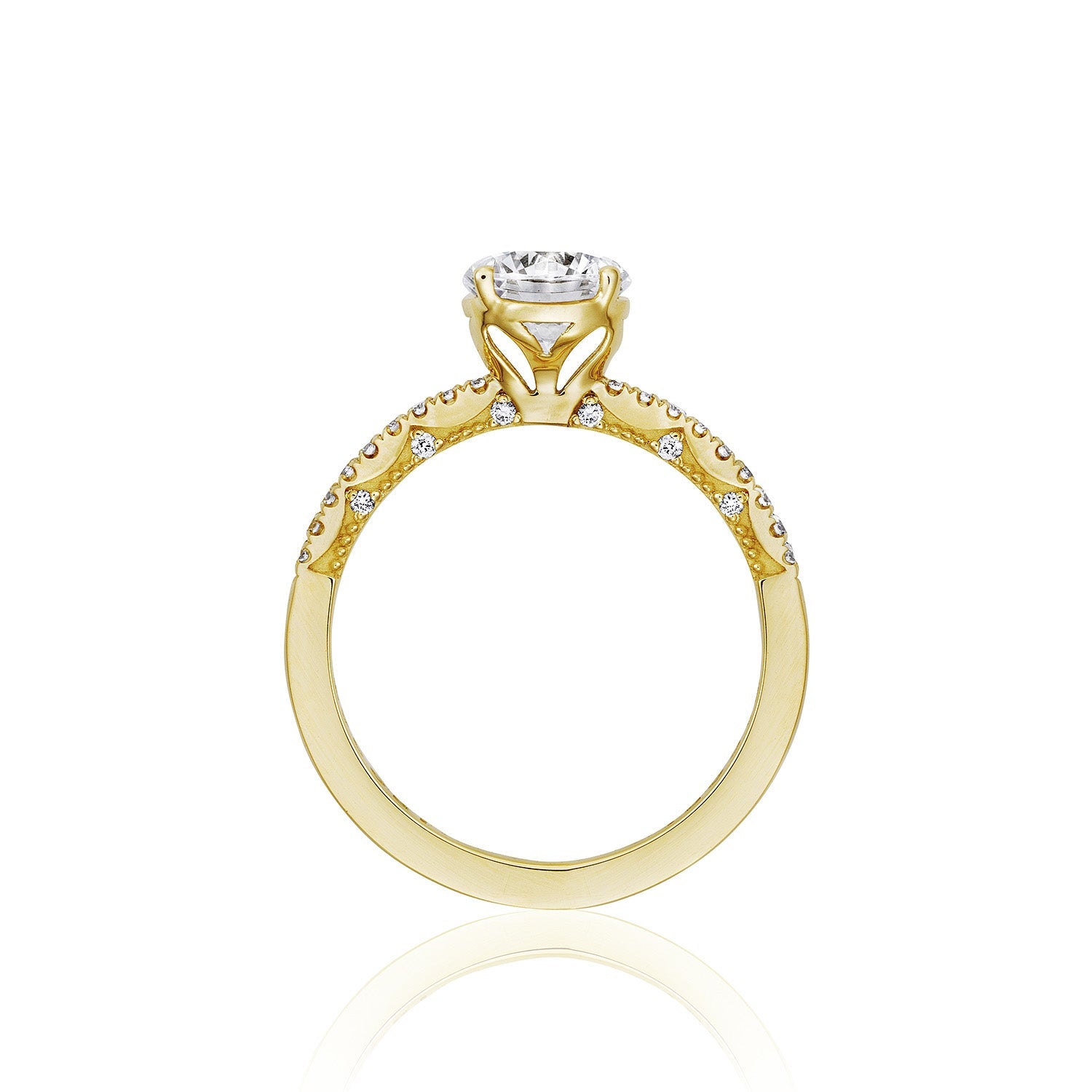 A side view of the Tacori Coastal Crescent 14K Yellow Gold Round Brilliant Solitaire Semi Mount Engagement Ring showcases intricate detailing and a central diamond setting. The band is adorned with round-brilliant diamonds along the top half, creating a delicate design that captures the elegance of Tacori.