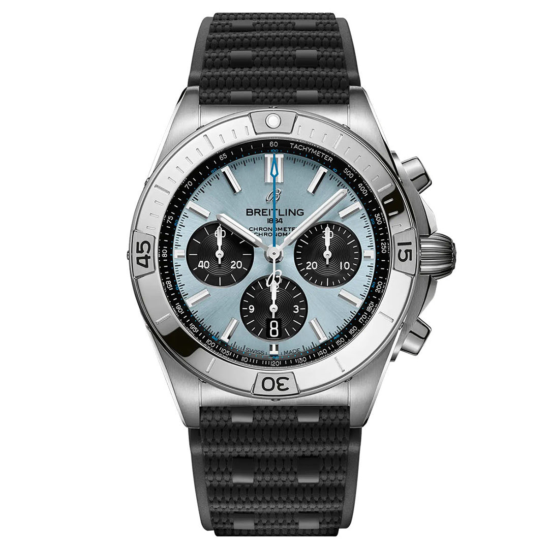 Introducing the sophisticated BREITLING Chronomat B01 42, featuring a black rubber strap and a stainless steel case. Its captivating teal dial showcases three subdials, silver hour markers, and a tachymeter scale on the bezel. This COSC-certified chronometer is equipped with luminescent hands and markers for outstanding readability.