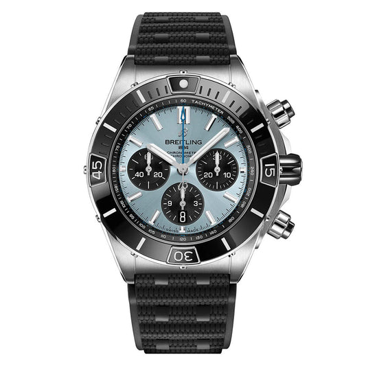 The BREITLING Super Chronomat B01 44 by Breitling is a luxury wristwatch with a black rubber strap and silver-tone case. It features a blue dial, three subdials, tachymeter scale on the bezel, metallic hour markers and hands, and the "Breitling" logo, crafted for precision and elegance.