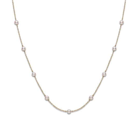 The Mikimoto 18K Yellow Gold Akoya Cultured Pearl Station Necklace enhances the neck's allure with its strategically placed Akoya pearls, exuding sophistication and elegance.
