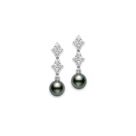 The Mikimoto 18K White Gold Diamond with Black South Sea Pearl Drop Earrings by Mikimoto feature diamond clusters arranged in a vertical line, each culminating in a single Black South Sea Pearl at the bottom. This symmetrical design beautifully combines the sparkle of diamonds with the rich luster of pearls.