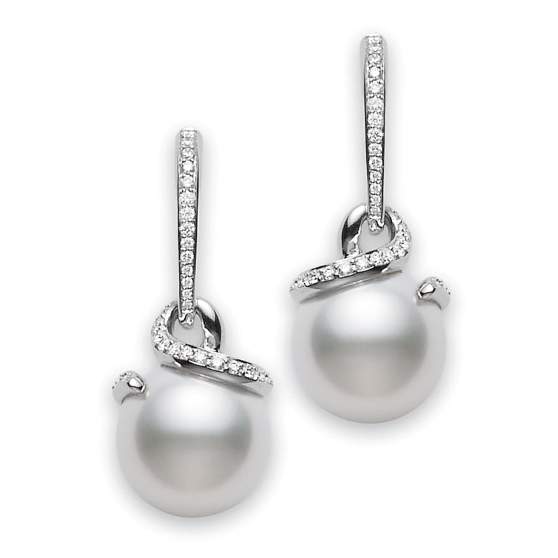 Mikimoto's 18K White Gold Diamond with South Sea Pearl Twist Drop Earrings elegantly display large South Sea pearls enhanced by delicate diamond accents, set in a white gold design. The sophisticated twist pattern adds an element of luxury and grace.