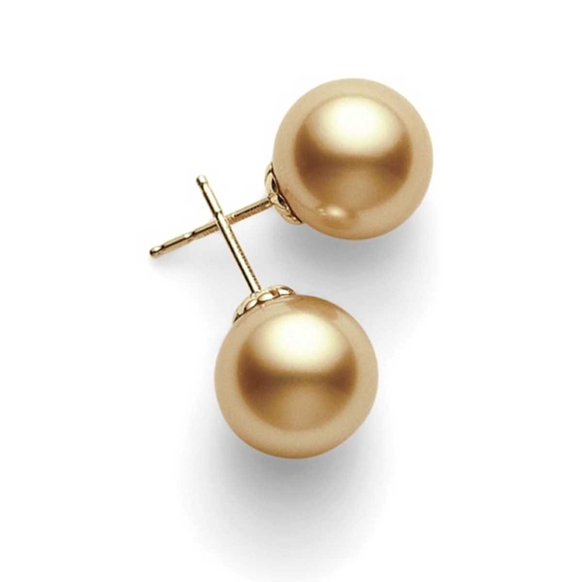 Displayed with one upright and the other lying flat, these Mikimoto 18K Yellow Gold Golden South Sea Pearl Stud Earrings feature smooth, lustrous cultured pearls that beautifully reflect light against their elegant 18K yellow gold settings.