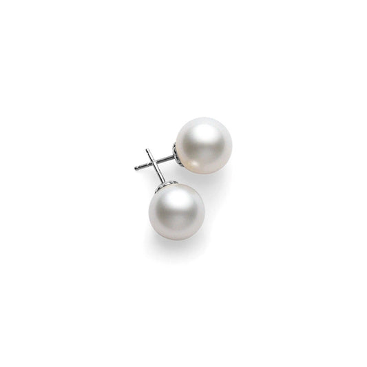 The Mikimoto 18K White Gold South Sea Pearl Drop Earrings showcase elegant round white pearls set on 18 Karat white gold posts, elegantly displayed against a plain white background.