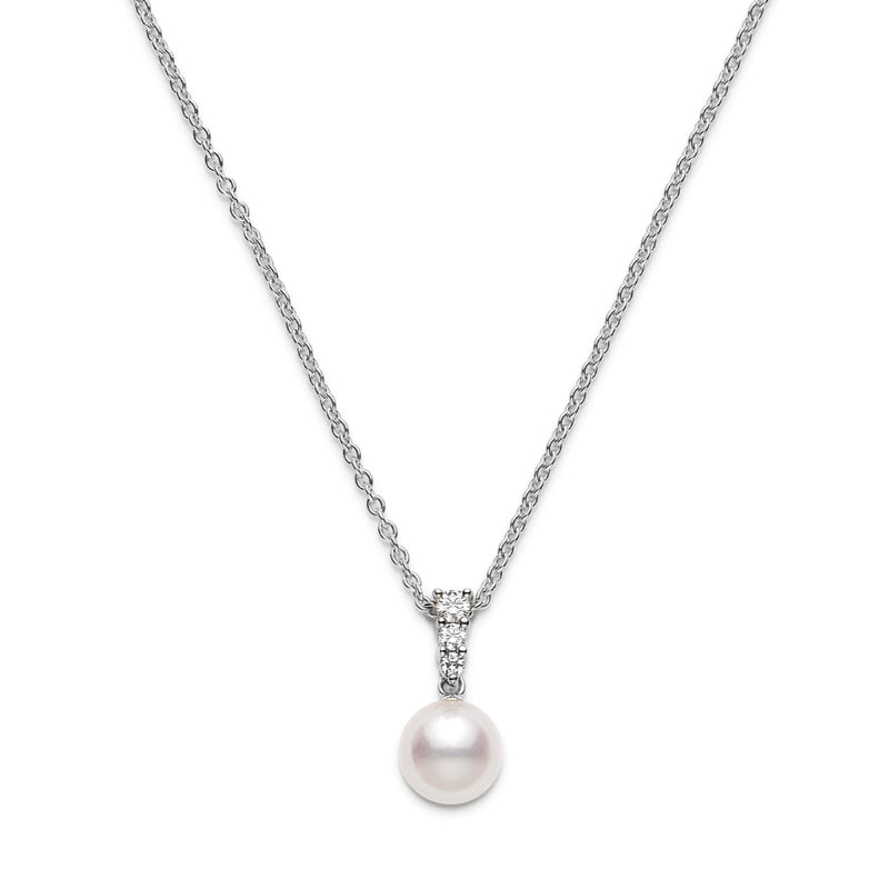 Introducing the Mikimoto Morning Dew 18K White Gold Diamond with Akoya Cultured Pearl Necklace Pendant. This exquisite piece showcases a single round Akoya cultured pearl pendant accented by delicate clear gemstones at the top. Masterfully designed by Mikimoto and part of their renowned Morning Dew collection, it highlights expert craftsmanship in 18k white gold against a pristine white backdrop.