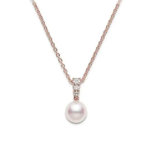 The Mikimoto Morning Dew 18K Rose Gold Diamond with Akoya Cultured Pearl Necklace Pendant showcases an elegant and minimalist design, featuring a single Akoya cultured pearl hanging from a loop adorned with diamonds, all set on a fine 18K rose gold chain.