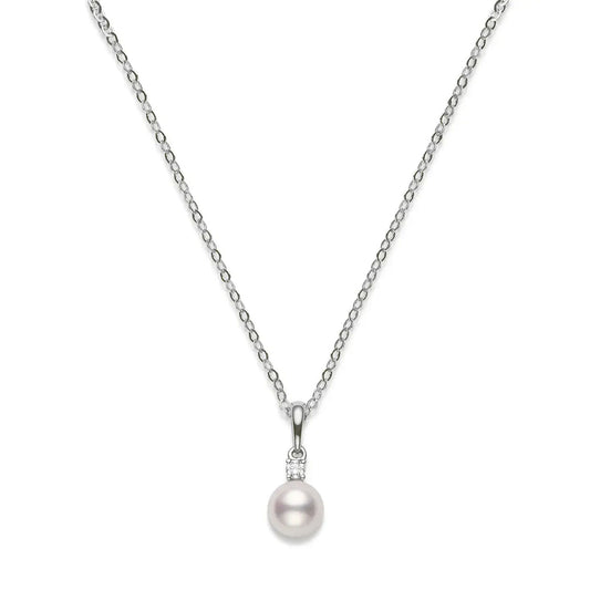 A Mikimoto 18K white gold necklace featuring a delicate chain and a South Sea pearl pendant with diamonds.