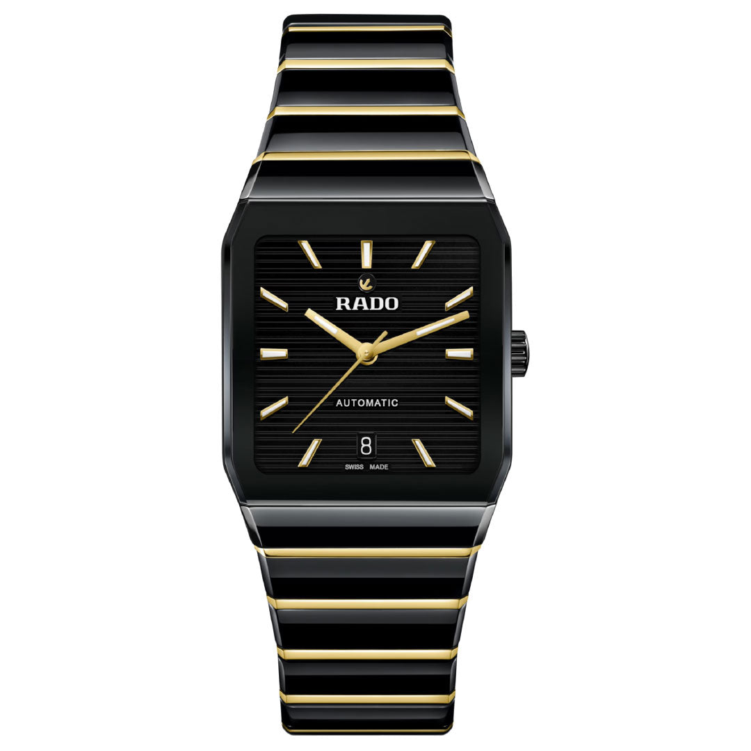The RADO Anatom Automatic 32.5mm Watch features a black face with gold hour markers and hands, a date display at 6 o'clock, and a black-and-gold striped high-tech ceramic bracelet under sapphire crystal.