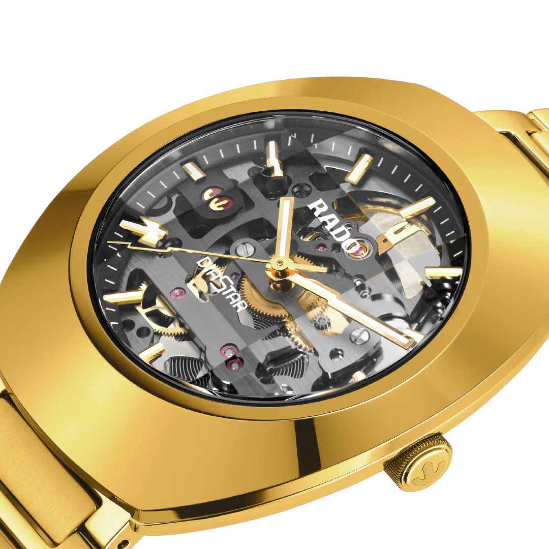 Close-up of the RADO DiaStar Original Automatic 38mm Watch, featuring a skeleton dial that reveals intricate gears and mechanical components beneath its transparent face, complete with gold hour markers and hands for an elegant touch.