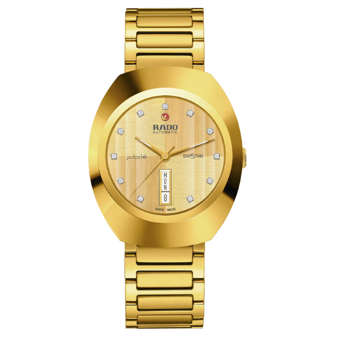 The RADO DiaStar Original Automatic 38mm Watch features yellow gold tone, a round face with diamond hour markers, day and date display at 6 o'clock, and a gold metal link band.
