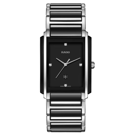 The RADO Intergal Diamonds Quartz 31mm Watch combines a rectangular case, black dial, silver hands, diamond markers, date at 6 o’clock, and a silver metal strap with black high-tech ceramic links for a luxurious look.