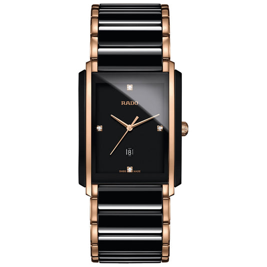 Discover the sophistication of the RADO Integral Diamonds Quartz 31mm x 41.1mm Watch. Featuring a rectangular black dial with rose gold accents, this luxury timepiece is equipped with slim gold hour and minute hands and a small date window at the bottom. Its two-tone black and rose gold band is enhanced by high-tech ceramic elements for a truly elegant finish.