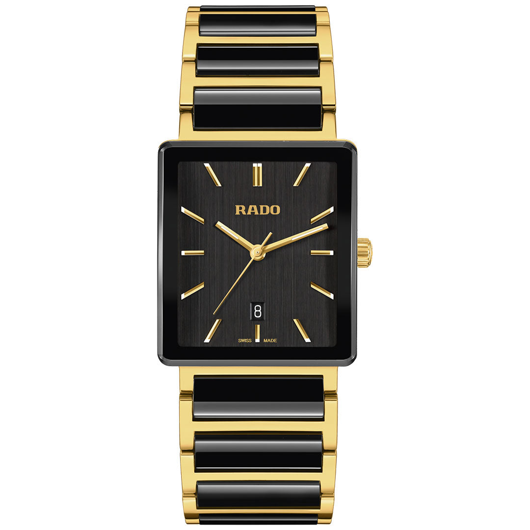 The RADO Integral Quartz 31.5mm watch features a rectangular black and gold face with gold markers and hands, a date window at 6 o'clock, and a stylish gold and black ceramic link bracelet.