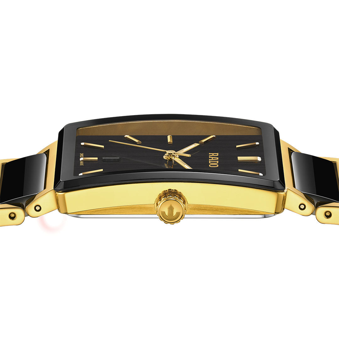 A close-up side view of the RADO Integral Quartz 31.5mm Watch features a rectangular gold and black design, black dial with gold hands and markers, gold-accented crown and links, and "RADO" displayed on the face.