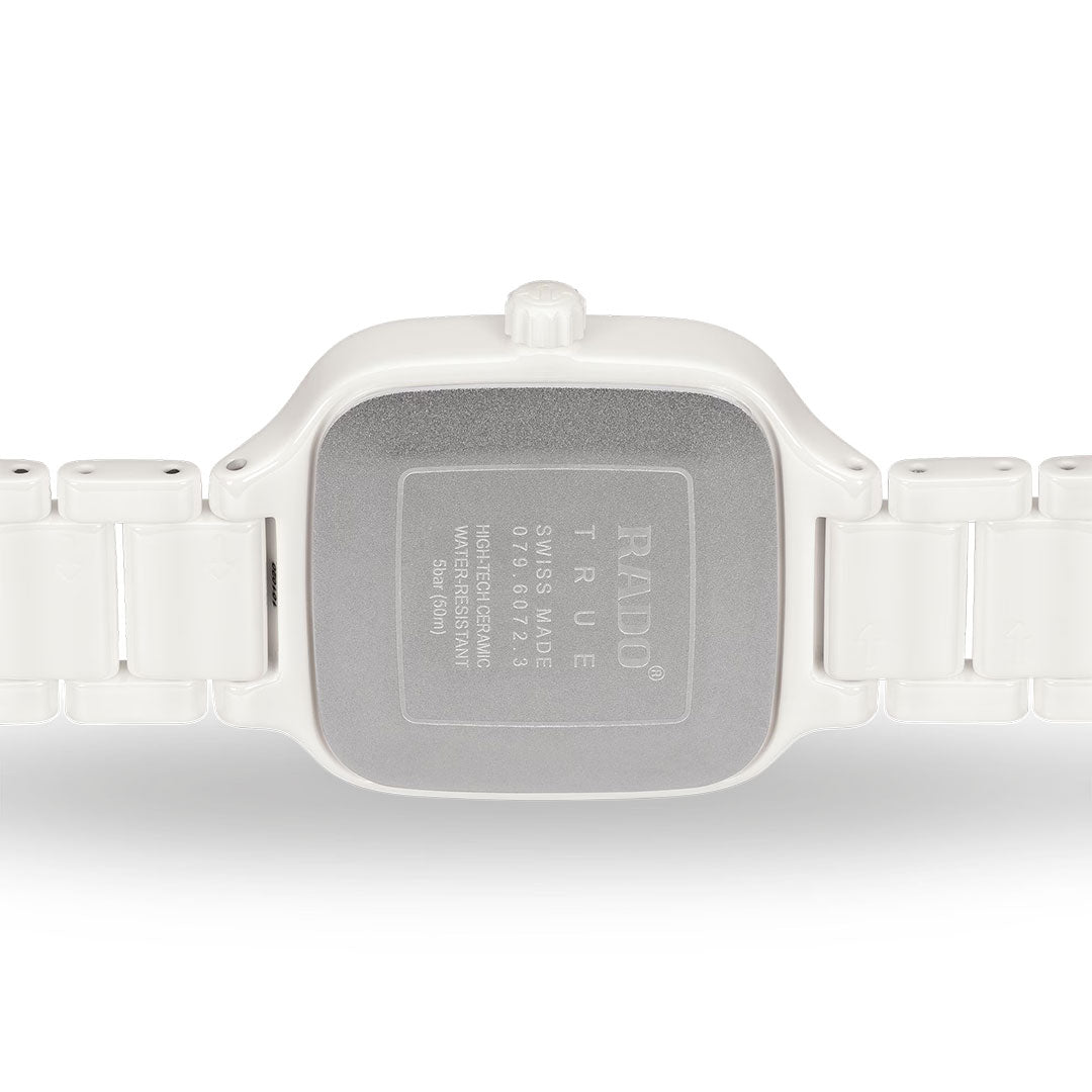 Back view of the RADO True Square Diamonds Quartz 29mm Watch in white, featuring a metal case back with engraved RADO branding and model details, attached to a high-tech ceramic strap.