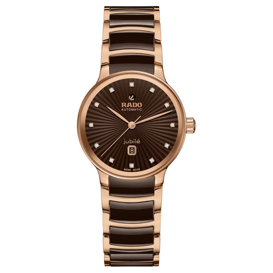 Experience ultimate sophistication with the RADO Centrix Diamonds Automatic 30.5mm Watch. This exquisite timepiece showcases a sleek design in rose-gold PVD-coated stainless steel paired with black accents. Its brown dial, embellished with diamond hour markers and a date display, is elegantly adorned with "Rado Automatic" and "Jubile.