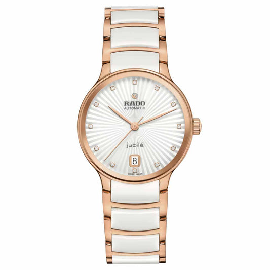 A gold and white wristwatch with a round face, featuring the brand name "RADO Centrix Diamonds Automatic 35mm Watch." The dial boasts gold hour markers, a date display at 6 o'clock, and is enhanced by a rose-gold-colored PVD-coated stainless steel strap.