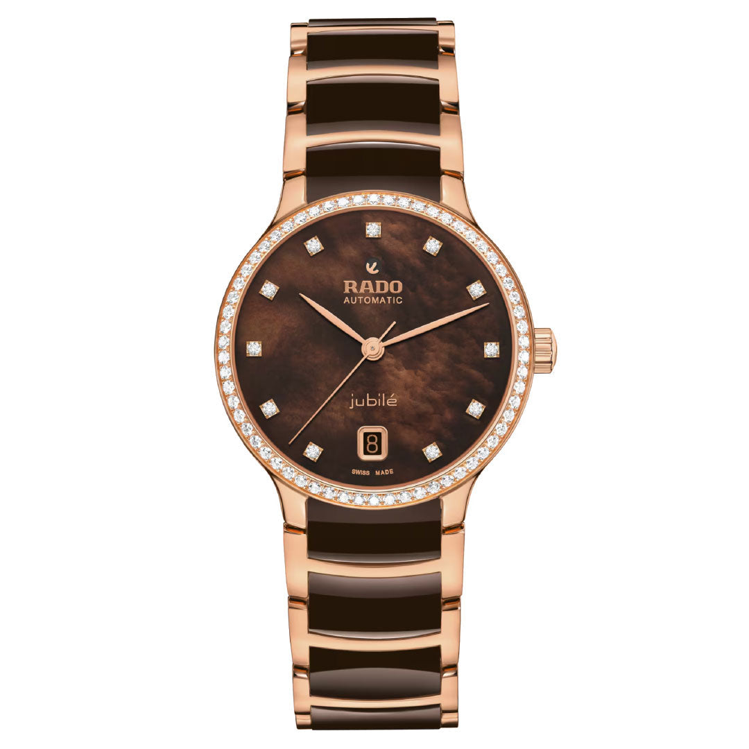 The RADO Centrix Diamonds Automatic 35mm Watch features a rose gold and dark brown ceramic band, a brown dial with diamond hour markers, a date window at 6 o’clock, and a bezel enhanced with diamonds.