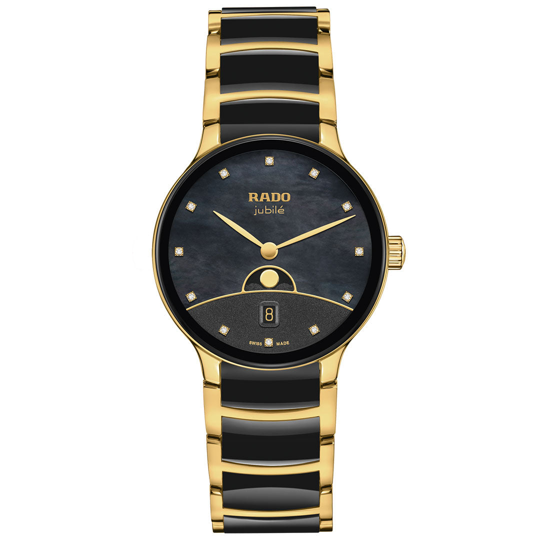The RADO Centrix Moonphase Quartz 35mm Watch features a round black dial, gold hands, diamond hour markers, a date display at 6 o’clock, and a high-tech ceramic bracelet for elegance.