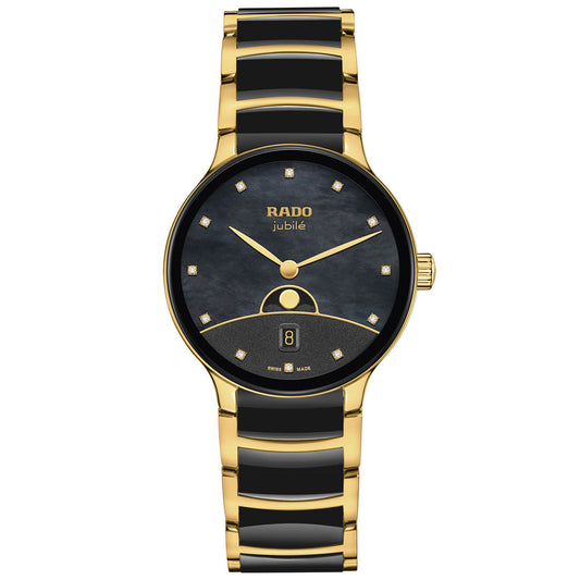 The RADO Centrix Moonphase Quartz 35mm Watch features a round black dial, gold hands, diamond hour markers, a date display at 6 o’clock, and a high-tech ceramic bracelet for elegance.