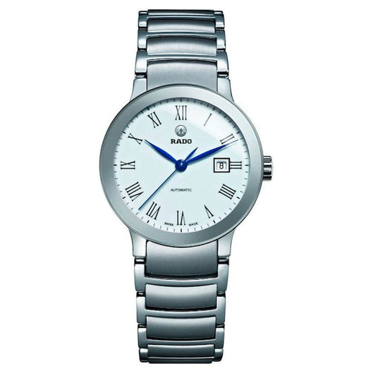 The RADO Centrix Automatic 28mm Watch, an elegant silver timepiece with a stainless steel band, exemplifies Swiss craftsmanship. It boasts a white dial accented by black Roman numerals and blue hands, along with a small date window at the 3 o'clock position, all driven by automatic movement.