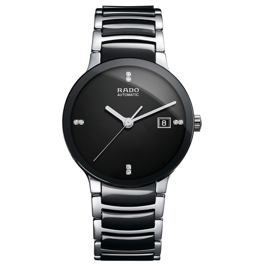 Introducing the RADO Centrix Automatic 38mm Watch, a stylish and sophisticated piece featuring a black dial adorned with metallic hour markers. It includes a date window positioned at 3 o'clock and boasts a silver strap integrated with black ceramic links. The watch is enhanced by silver-toned hands, all safeguarded by scratch-resistant sapphire crystal.