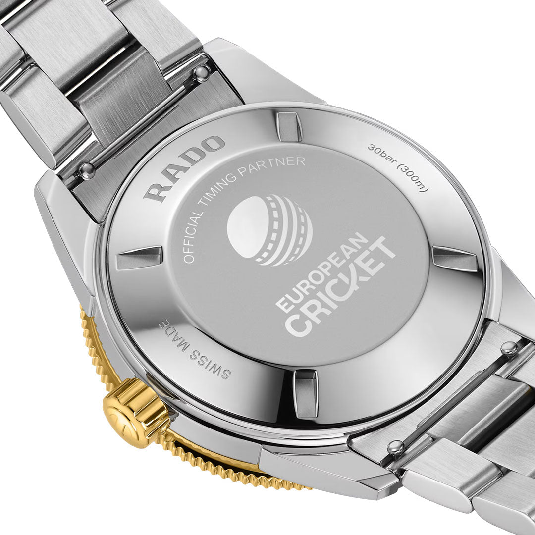 Close-up of the back of the RADO Captain Cook X European Cricket Special Edition Automatic 42mm Watch in silver, featuring “EUROPEAN CRICKET” and a cricket ball motif engraved to highlight the exclusive branding and partnership, as well as display its sophisticated automatic movement.