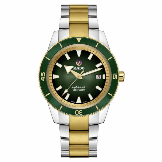 The RADO Captain Cook Automatic 42mm Watch features a vibrant green dial paired with a gold and silver metal band. It includes a rotating bezel, luminous hands, hour markers, and a date display located at 3 o'clock. The stainless-steel bracelet harmonizes beautifully with the Rado R763 automatic movement, offering seamless elegance.