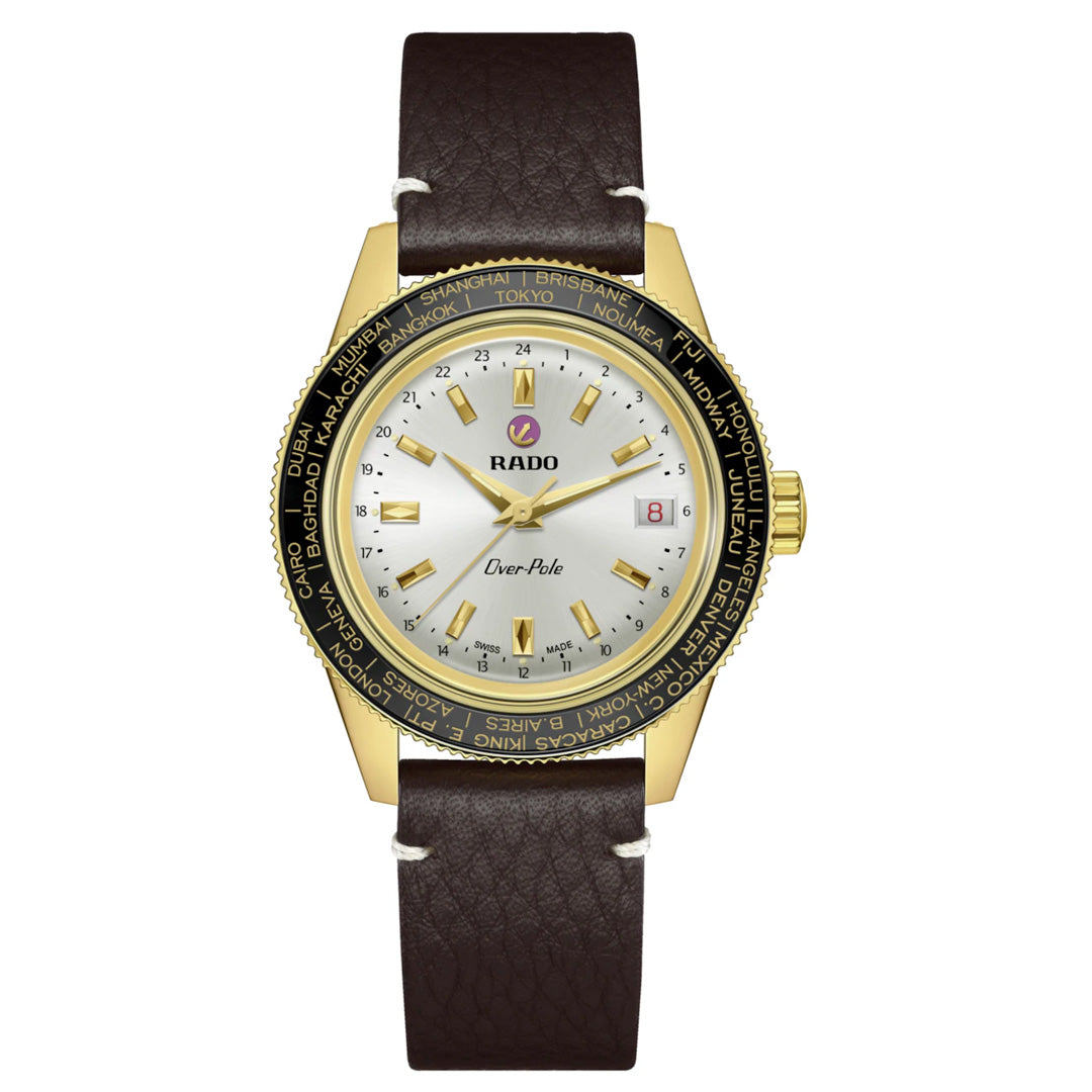 The RADO Captain Cook Over-Pole Limited Edition Handwinding 39mm Watch features a round gold case, white dial, gold markers, date window, brown leather strap, and world cities bezel—powered by a manual-winding Worldtimer movement.