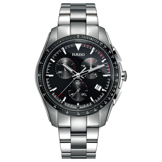 A sleek and sporty silver wristwatch with a durable stainless steel band, the RADO HyperChrome Chronograph Quartz 44.9mm Watch showcases a black watch face with three sub-dials, a date window at the 4 o'clock position, and eye-catching red accents on its hands and markers. The elegant RADO branding is positioned just below the 12 o'clock mark, adding an extra layer of sophistication.
