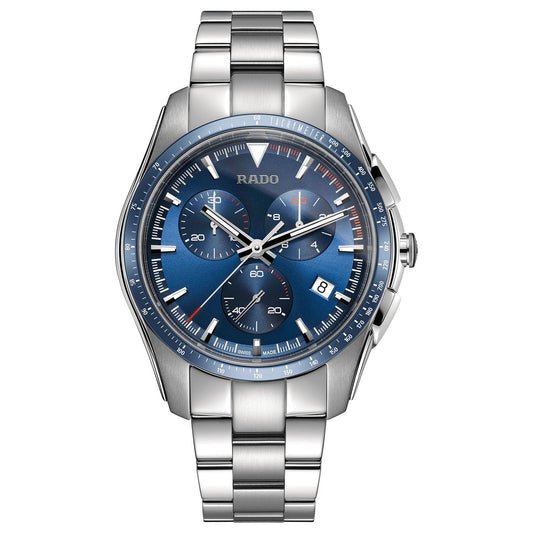 Introducing the RADO HyperChrome Chronograph Quartz 44.9mm Watch, a sporty timepiece featuring a 45mm blue dial with three subdials, a date display, and tachymeter markings. The luminous hour markers and hands enhance its style, while the stainless steel bracelet with clasp ensures lasting durability. This silver metal wristwatch perfectly captures the essence of the RADO brand.