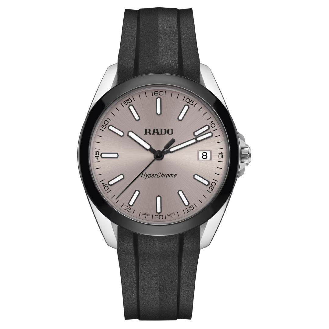The RADO HyperChrome Quartz 41.5mm Watch features a black rubber strap, silver dial, high-tech ceramic bezel, white hour markers, luminescent hands and markers for visibility, a date at 3 o’clock, and is powered by the Rado calibre R292.
