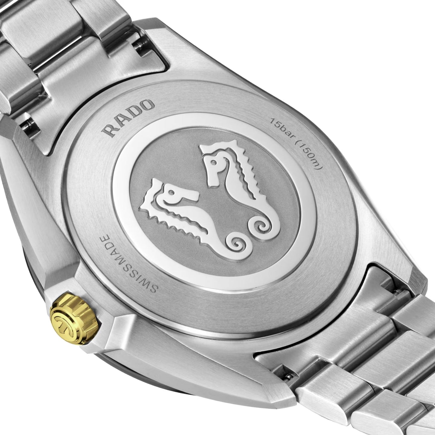 Close-up of the RADO HyperChrome Quartz 41.5mm Watch's silver back, showing engraved seahorses, "SWISS MADE," water resistance "15 bar (150m)," a gold crown, and high-tech ceramic bezel.