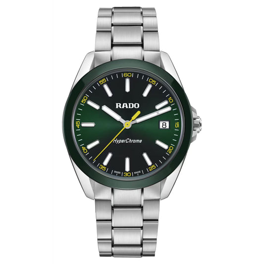 The RADO HyperChrome Quartz 41.5mm Watch features a stainless steel case, green dial, green ceramic bezel, yellow minute markers, silver hour markers and hands, date at 3 o'clock, metal bracelet strap, and Rado calibre R292.