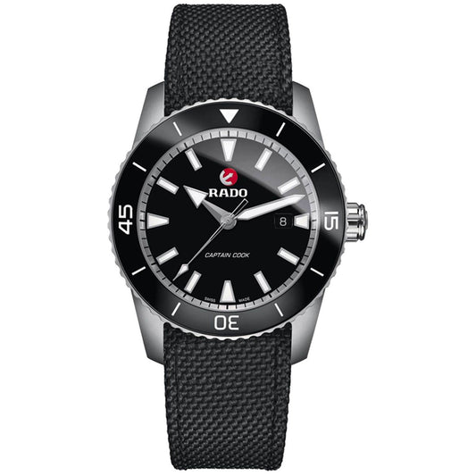 The RADO HyperChrome Captain Cook Automatic 45mm Watch features a black dial, stainless steel case, and rotating bezel. It includes white markers, a date window at 3 o'clock, and a textured black strap. The Swiss-made ETA automatic movement guarantees precision beneath the iconic RADO logo located below the 12 o'clock position.