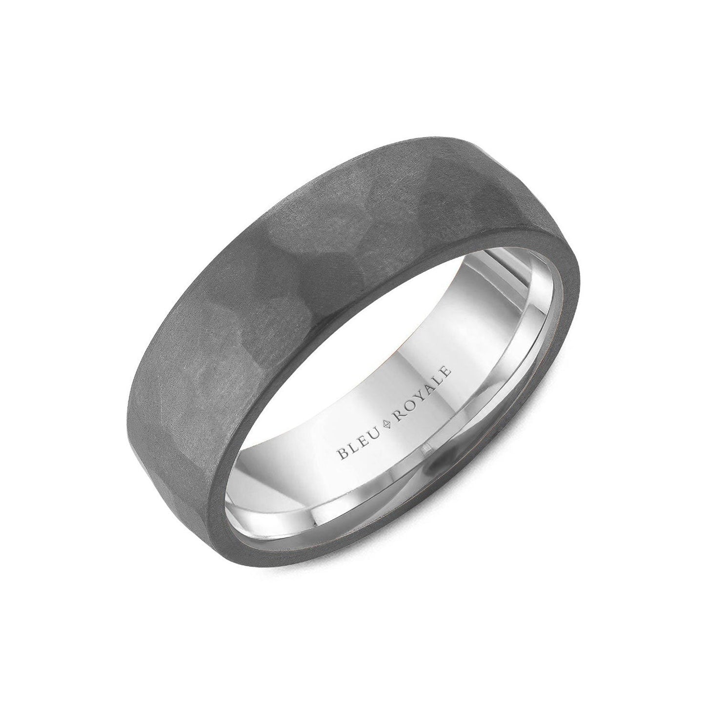 The Crown Ring Bleu Royale Tantalum and 14K White Gold Men's Wedding Band features a matte, textured dark gray exterior paired with a polished interior. It is engraved with "Bleu Royale" and is displayed at a slight angle against a white background.