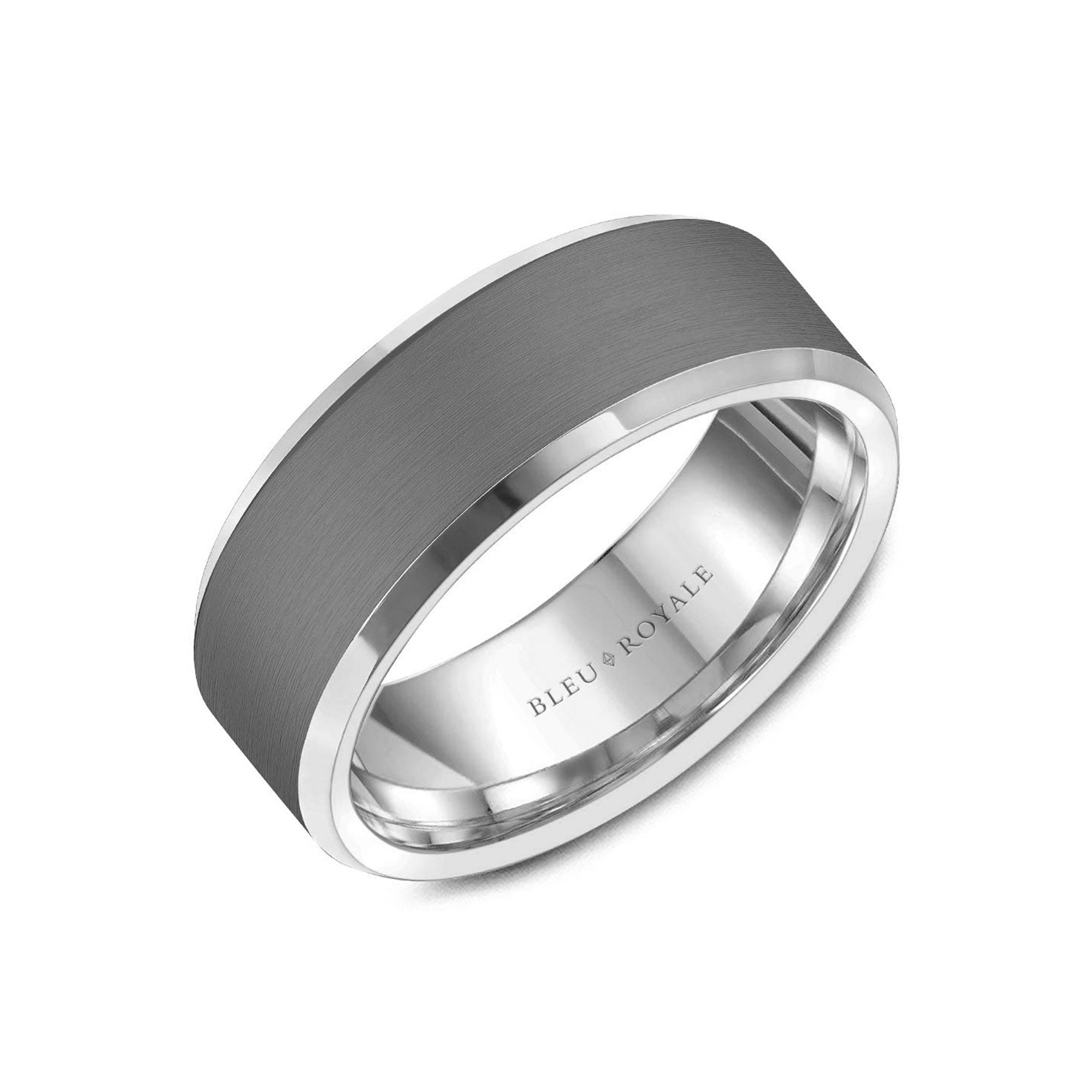 Introducing the Crown Ring Bleu Royale Tantalum and 14K White Gold Men's Wedding Band, which boasts a sleek modern design. This sophisticated ring features a matte black finish on the tantalum outer band, complemented by a lustrous silver shine from the 14K white gold inner band. Perfectly set against a plain white background, this piece epitomizes elegance and style.