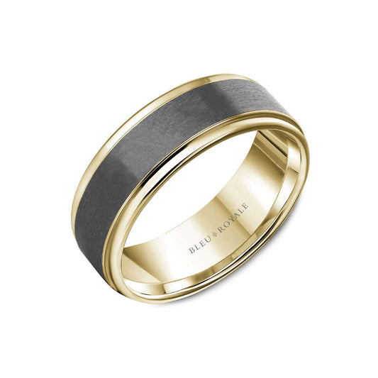 The Crown Ring Bleu Royale Tantalum and 14K Yellow Gold Men's Wedding Band showcases a smooth, polished finish in gold and dark gray. The inner band subtly highlights "BLEU ROYALE." This piece combines tantalum and 14K yellow gold to create a distinctive modern design.